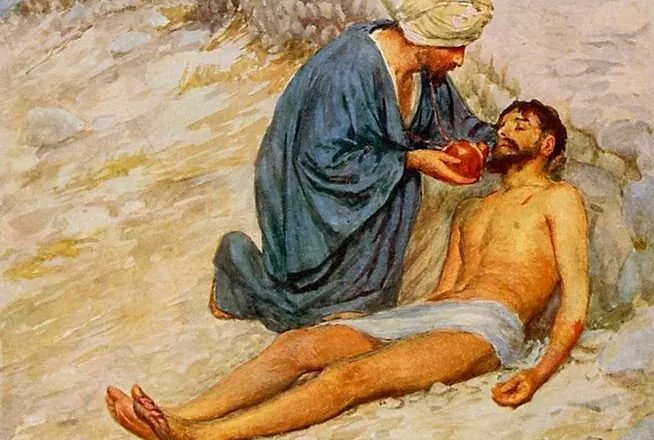 Miłosierny Samarytanin pomaga rannemu człowiekowi leżącemu przy drodze